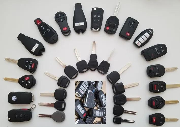 Collection of automotive key fobs and remotes serviced by Cherubims G 3:24 Mobile LockSmith